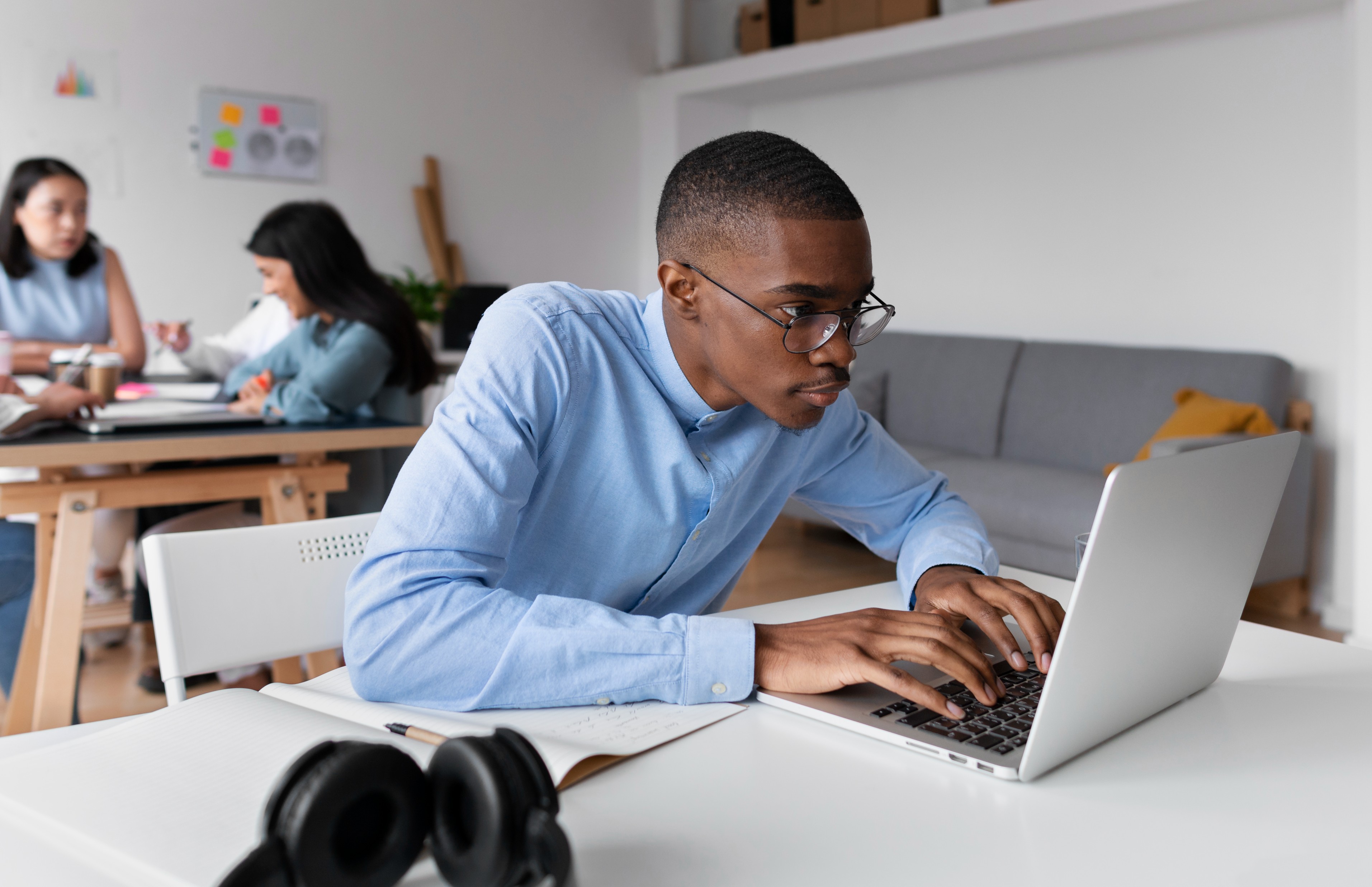 individual using his laptop PCs